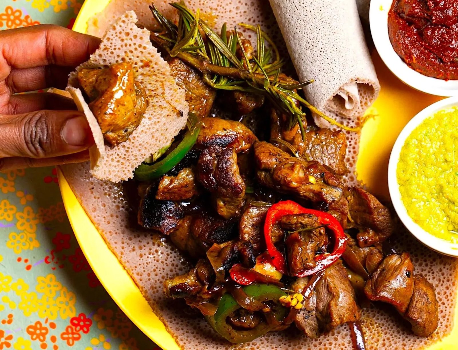 Derek tibsi — grilled meat with peppers and rosemary, on injera